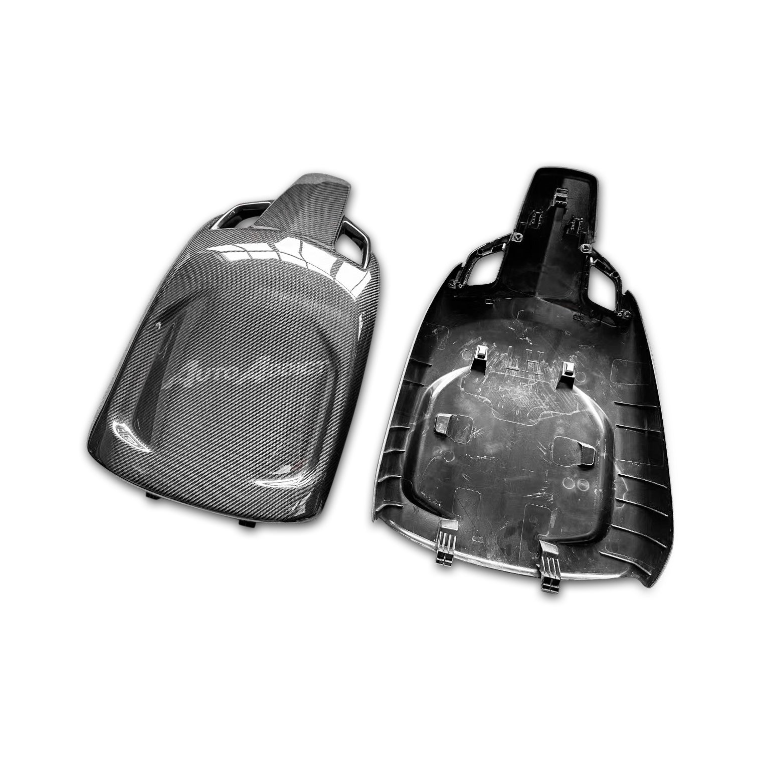 Two carbon fiber car parts on a white background