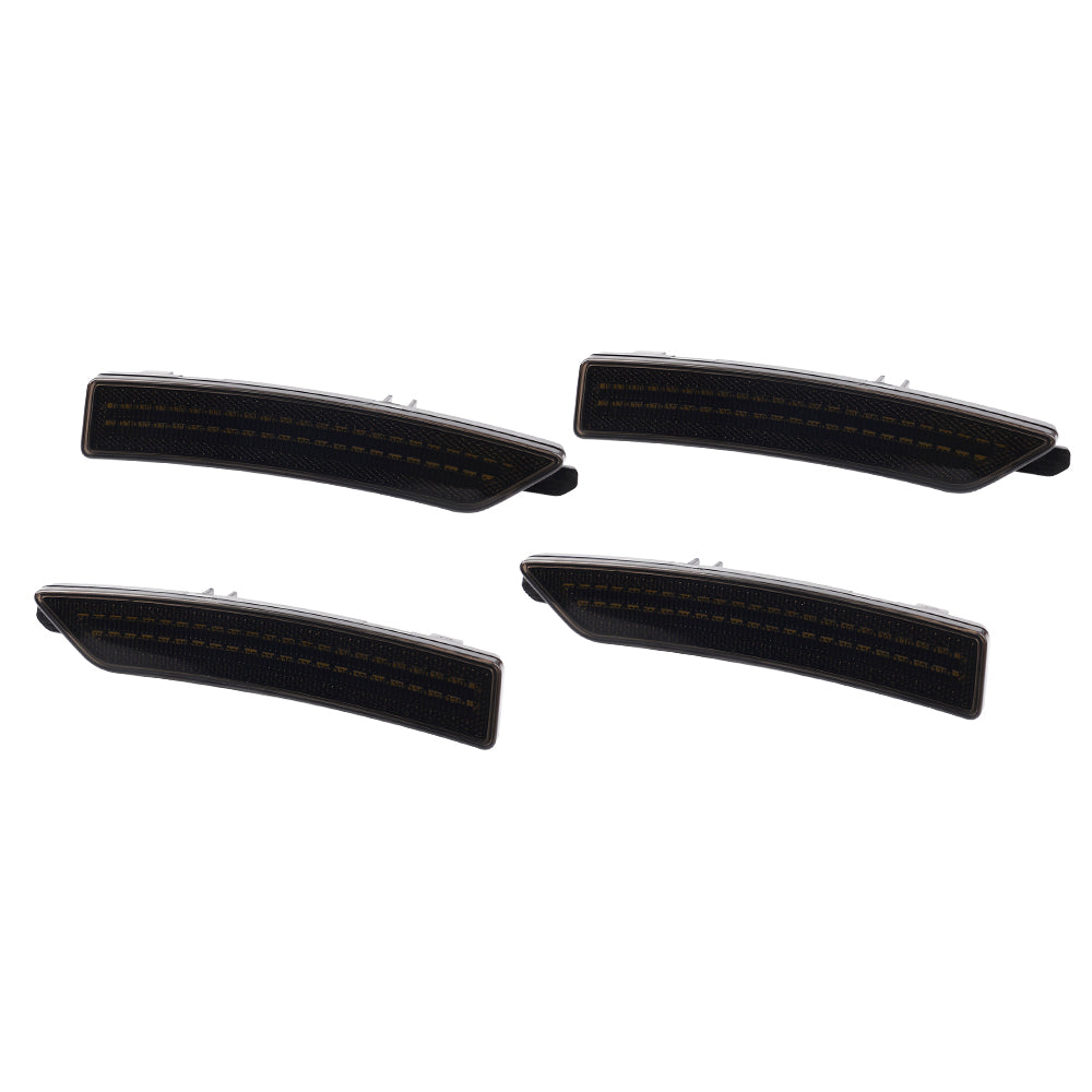 Four black car fog lights on a white background