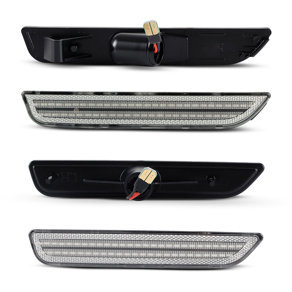 Two black car side mirrors with LED lights on a white background