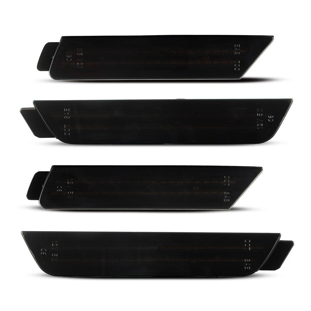 Set of five black car side skirts on a white background