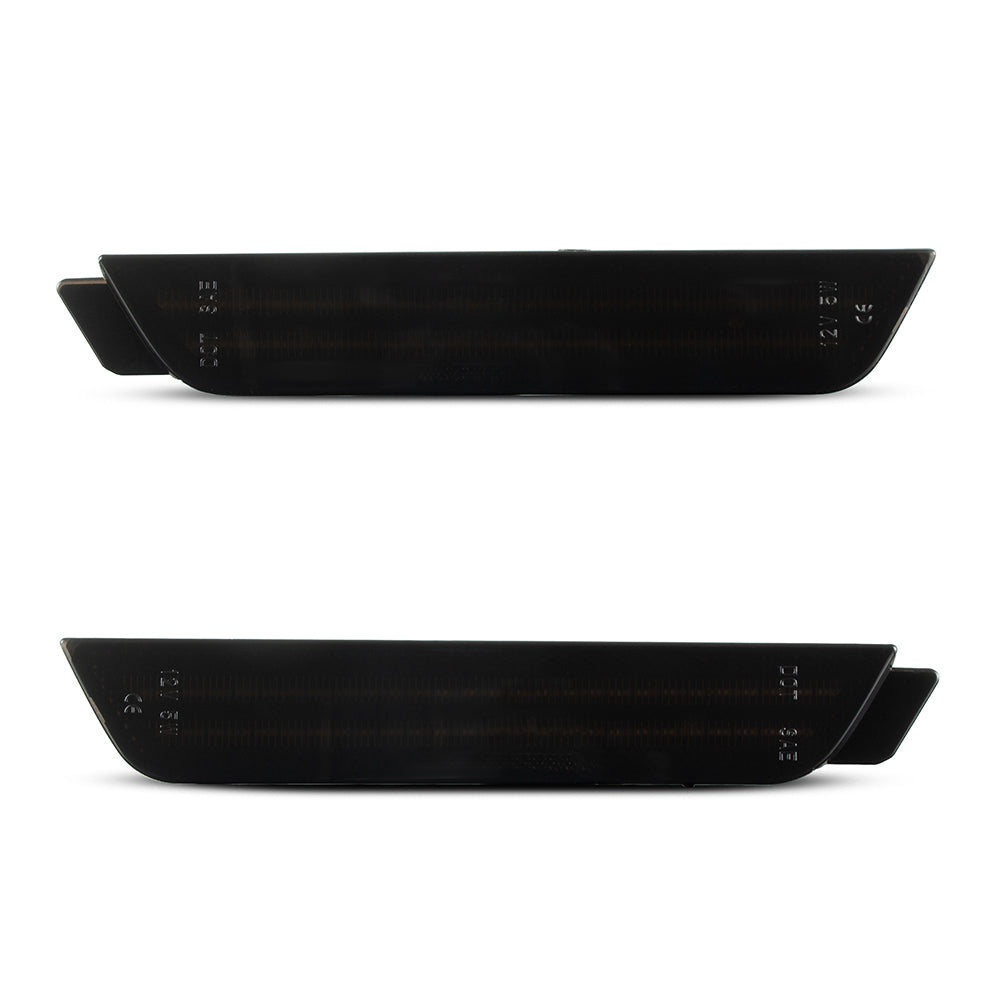 Two black car side skirts on a white background