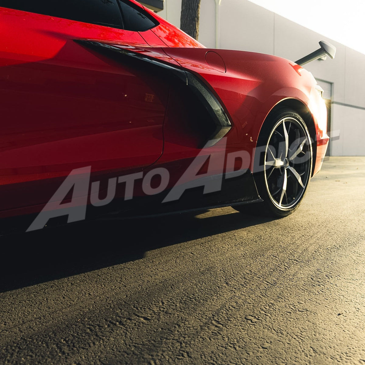 Close-up of gloss black EVO side skirt on Corvette C8 Stingray
