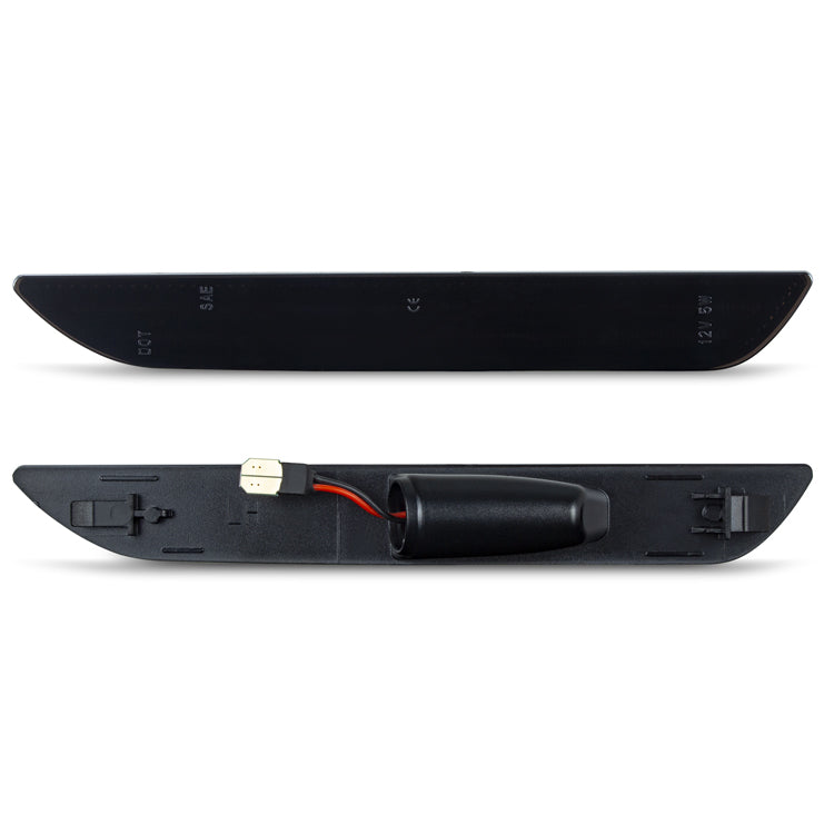 Black car bumper with wiring on a white background