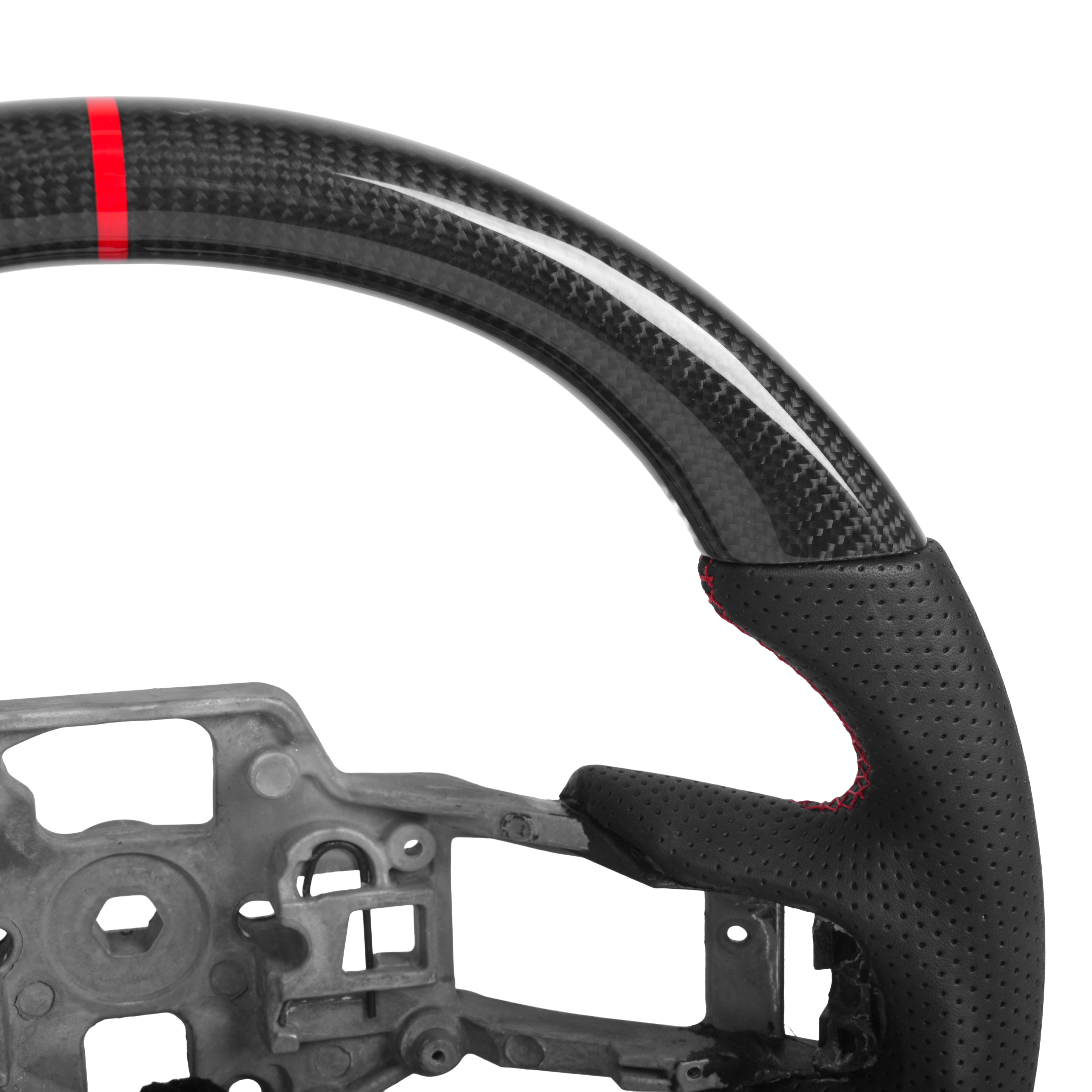 Black perforated leather steering wheel grip close up with red contrast stitching on heated carbon fiber Mustang wheel