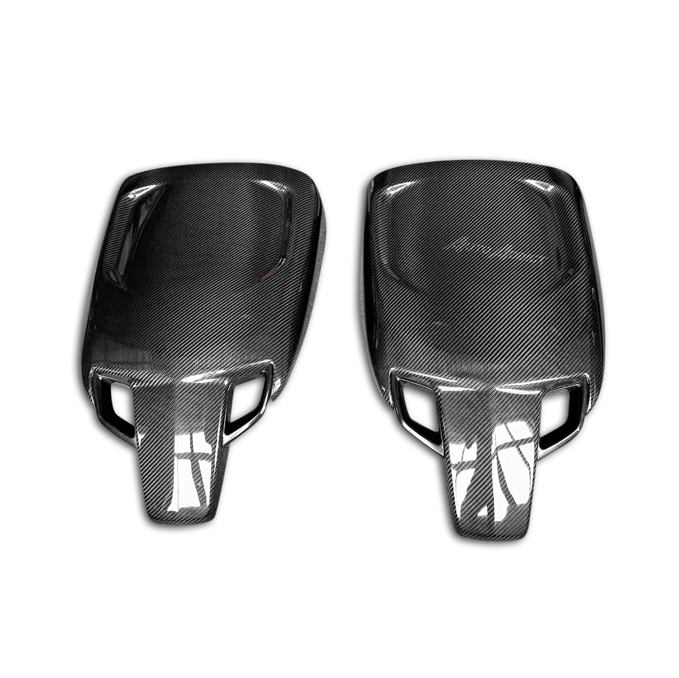 Two carbon fiber car mirror covers on a white background