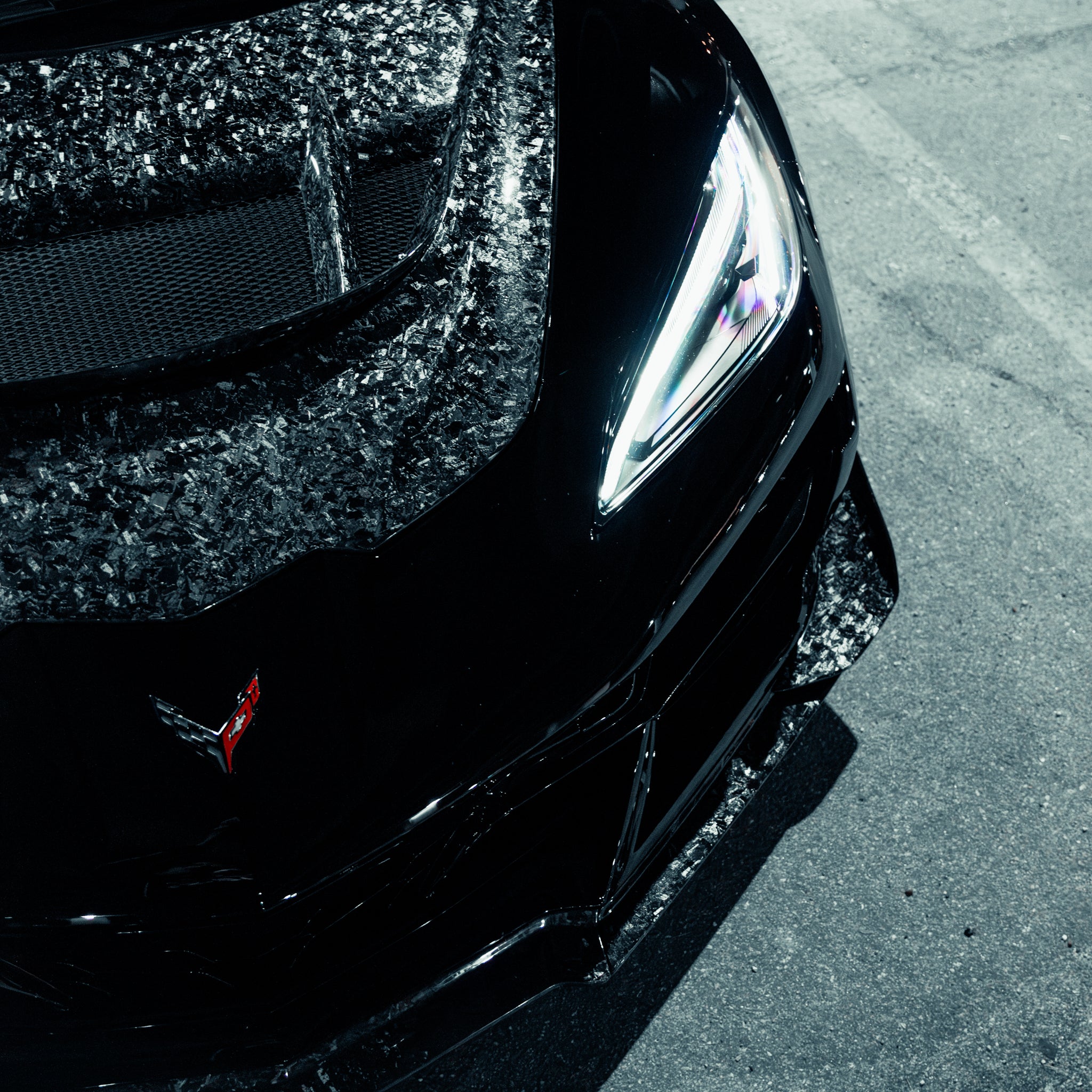 Close up forged carbon front splitter edge detail for C8 Corvette ZR1 ZTK kit
