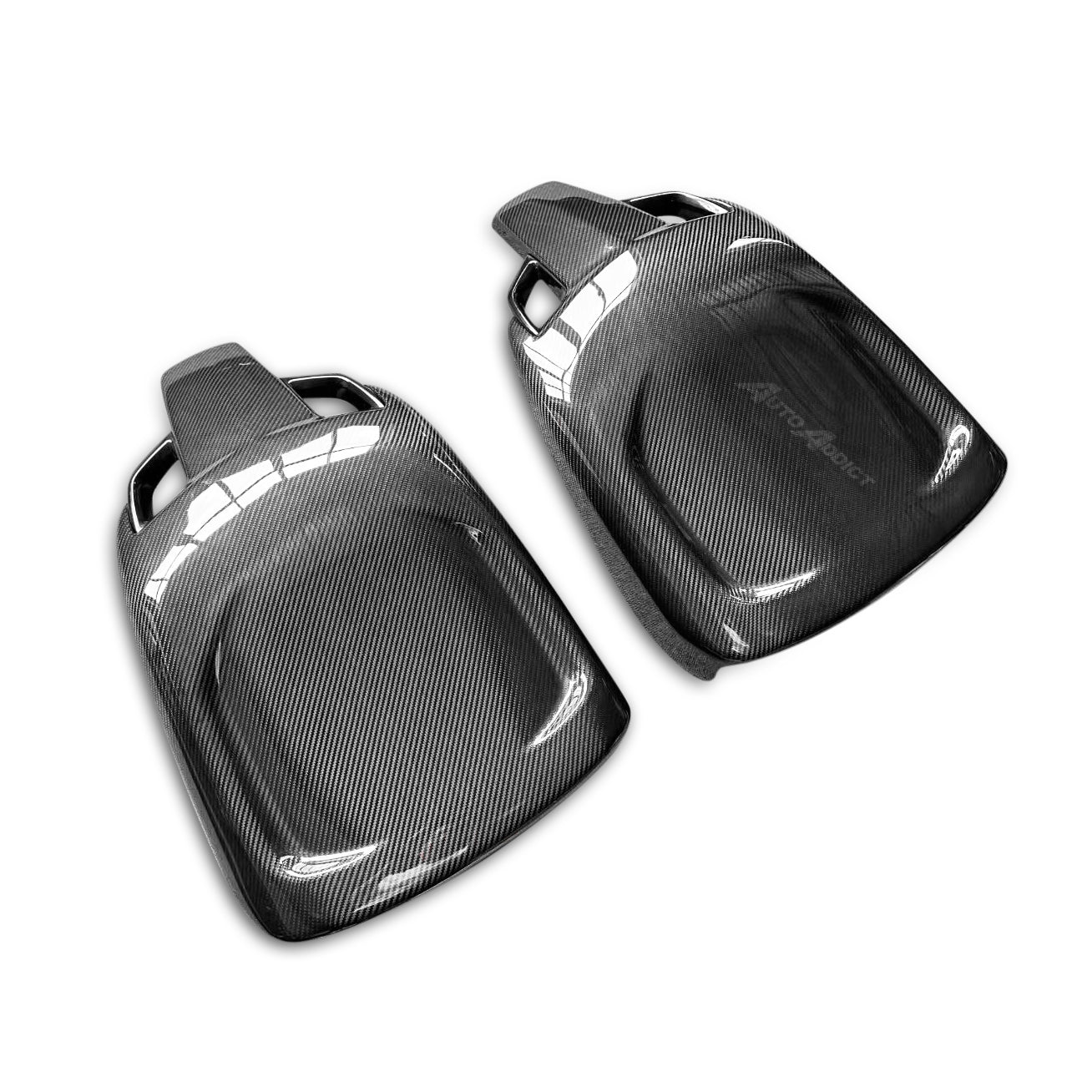 Two carbon fiber car parts on a white background