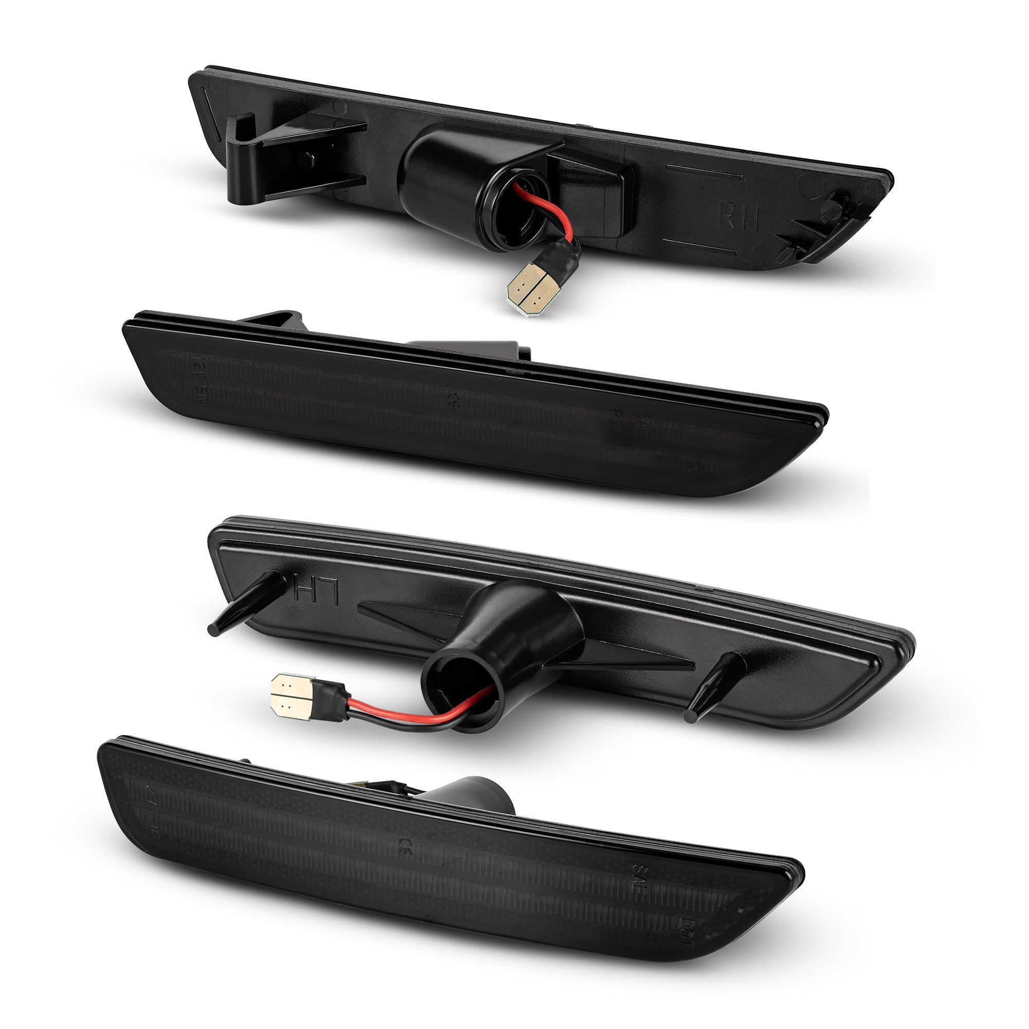 Set of four black car bumper lights on a white background