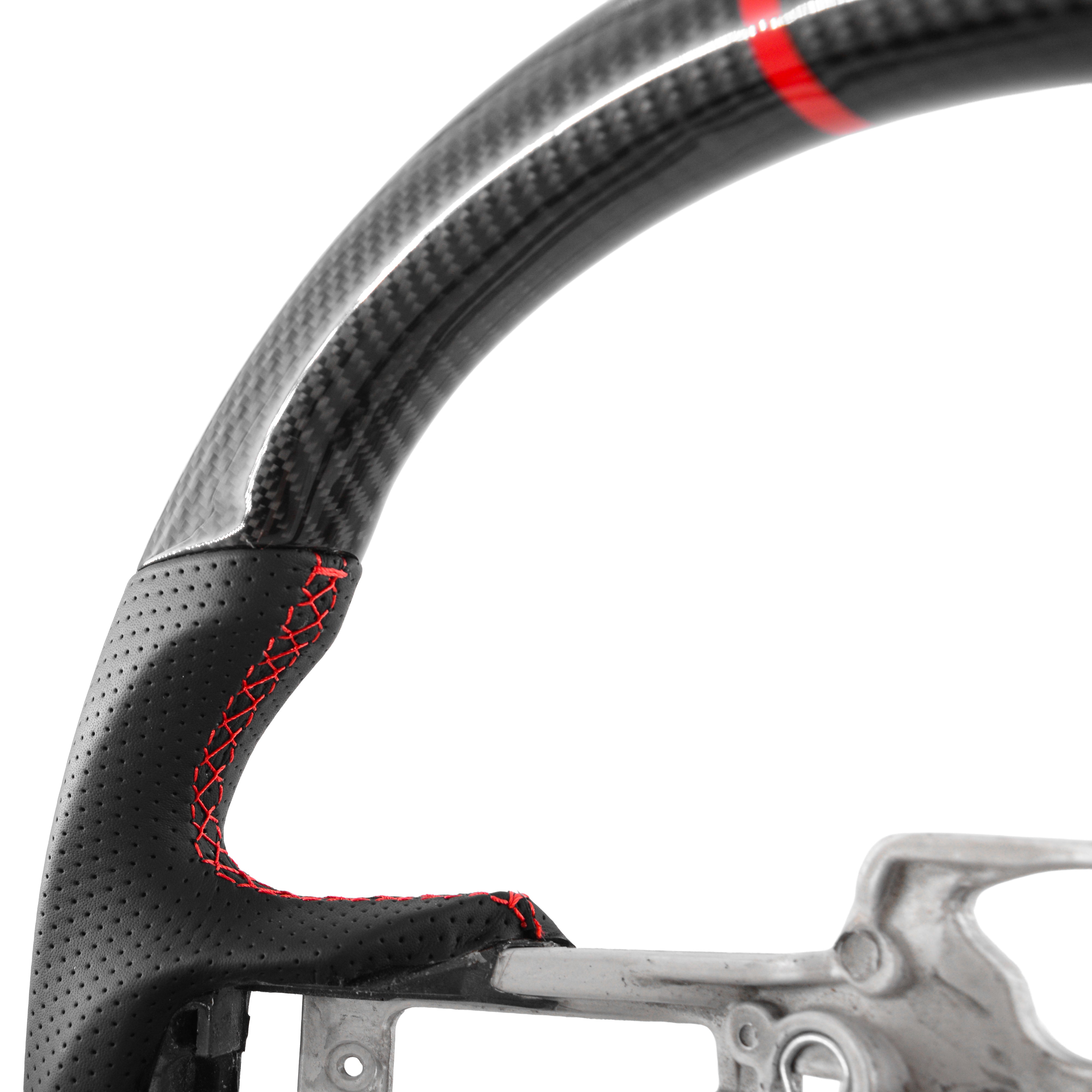 Real carbon fiber steering wheel core close up showing high-gloss carbon weave and premium finish