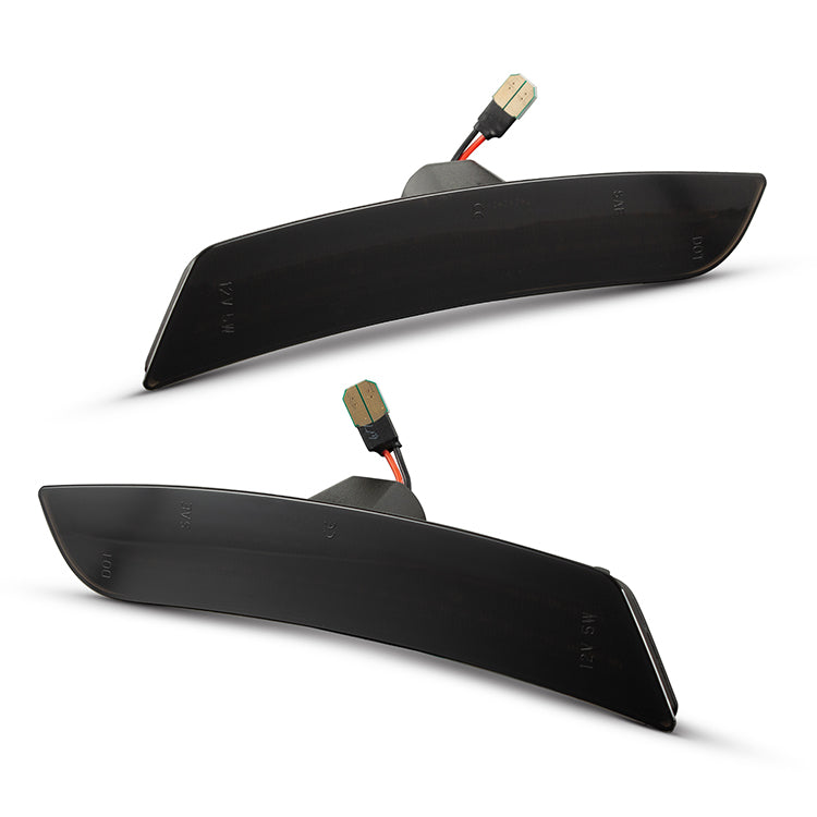 Two black car side mirrors with connectors on a white background